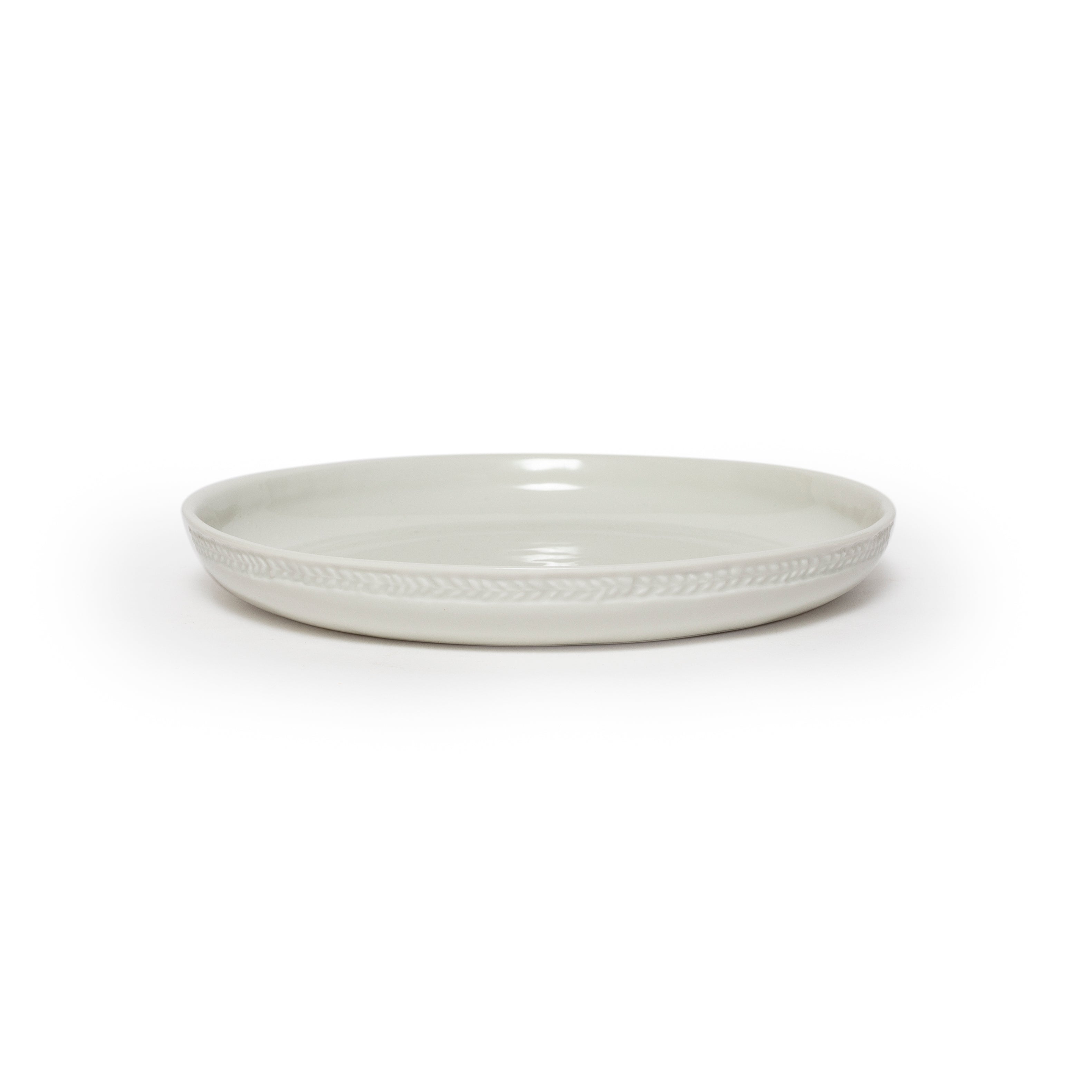 White ceramic plate on a white background