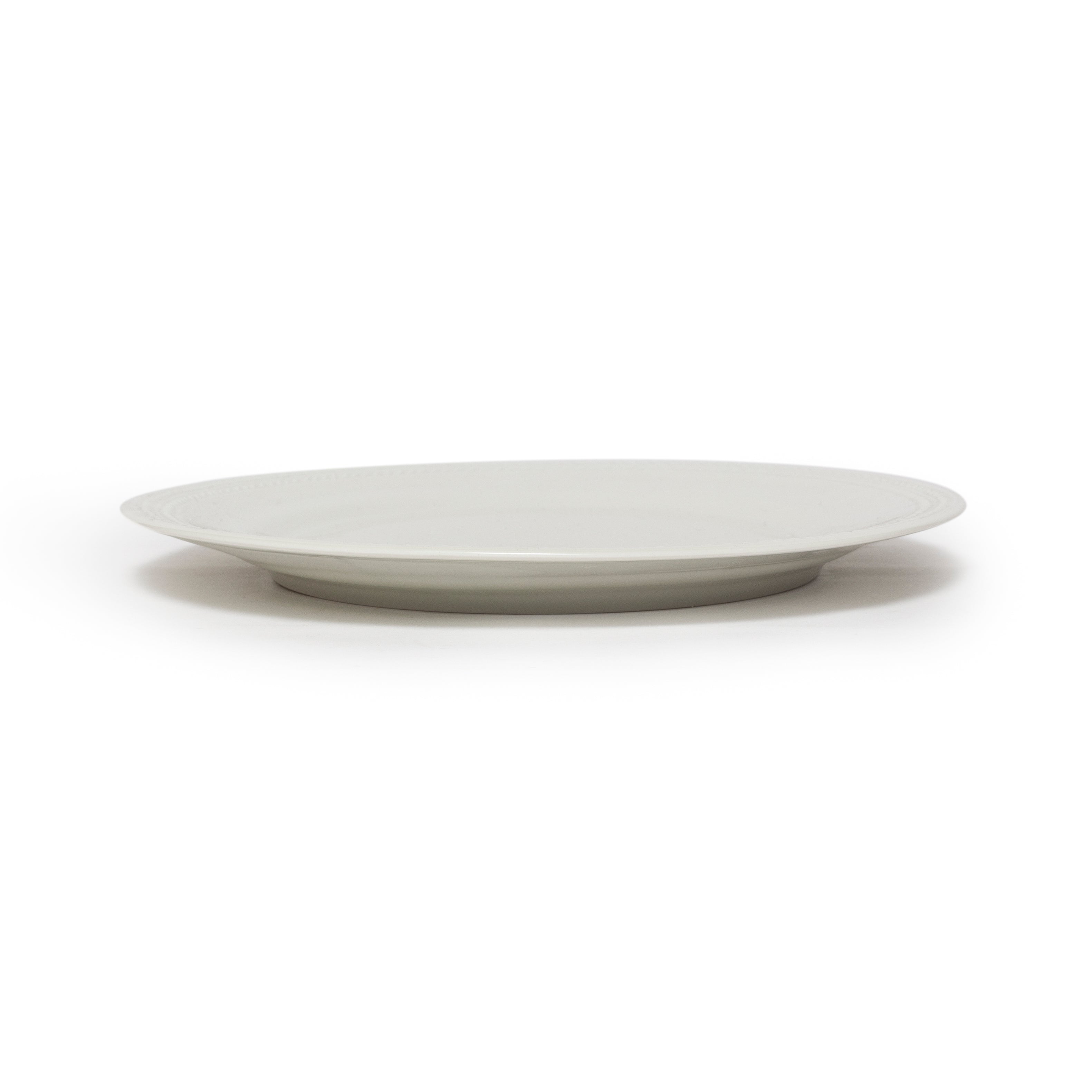 White ceramic plate on a white background