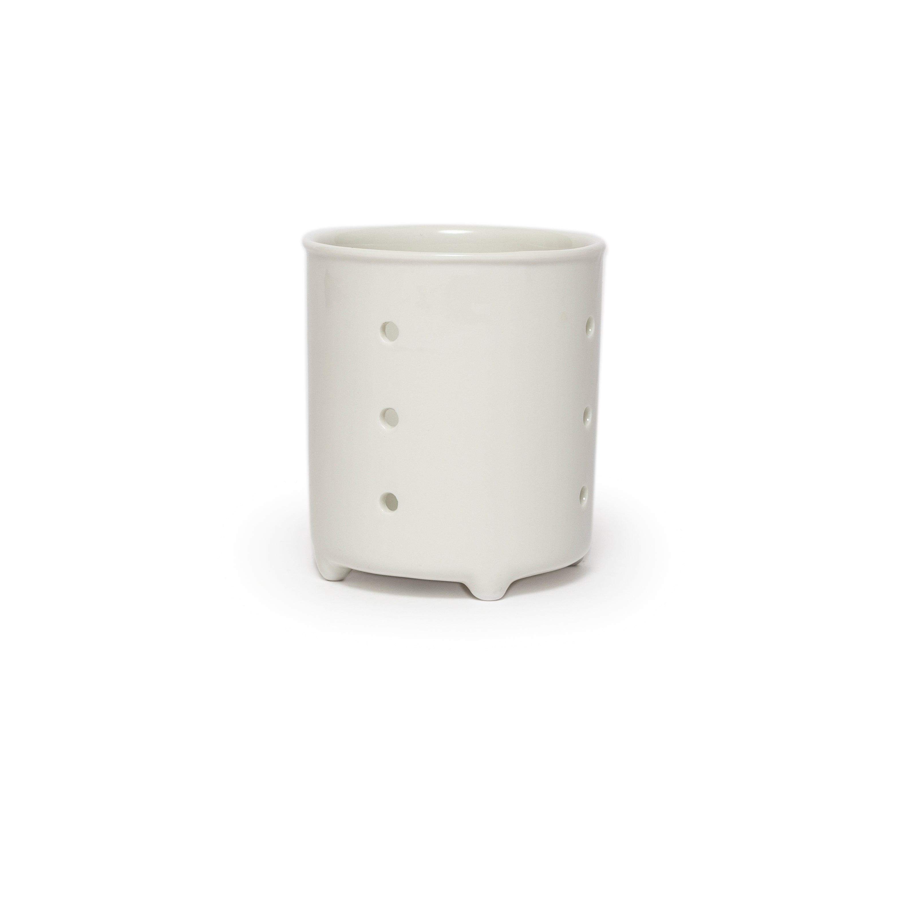 White ceramic jar with small holes on a white background
