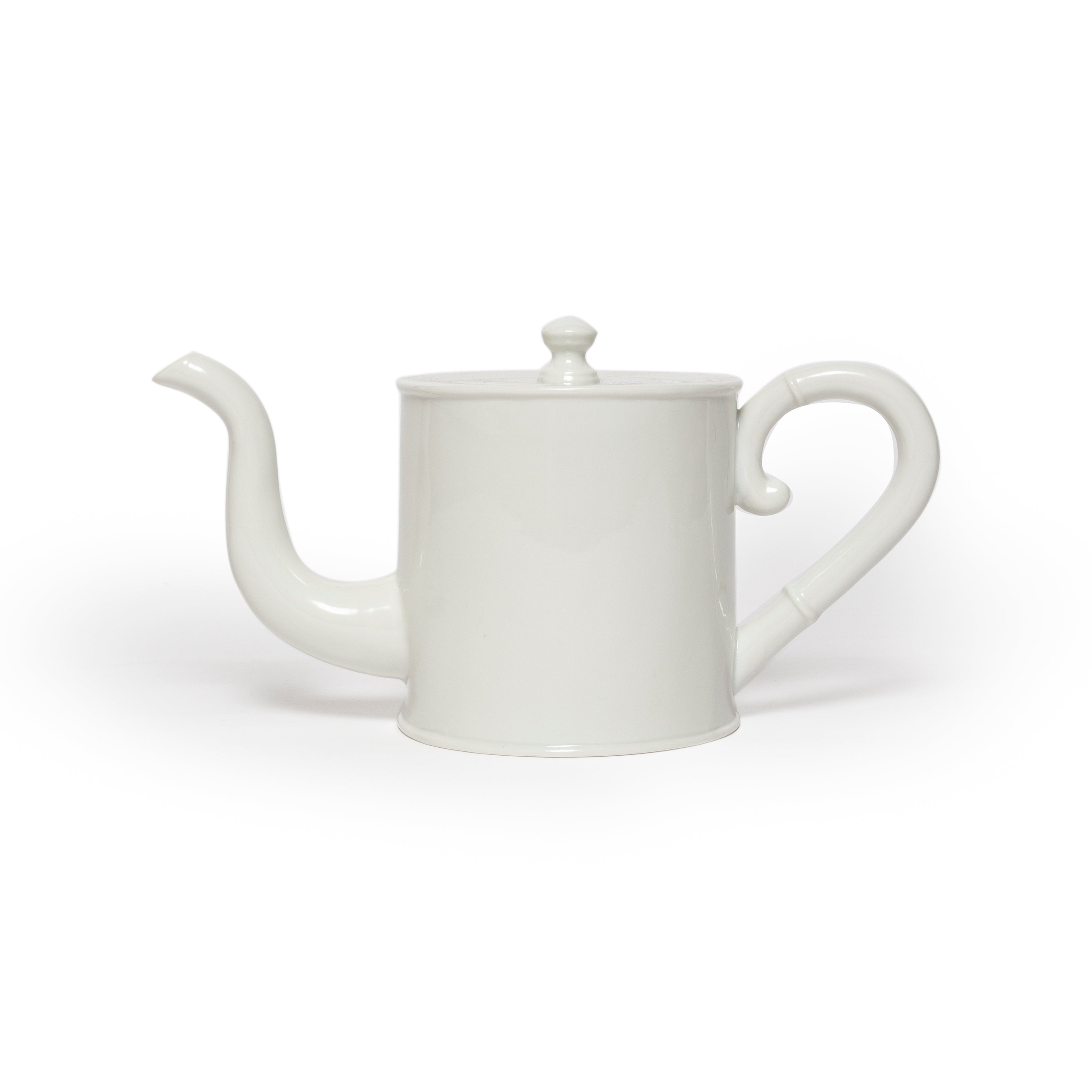 White teapot on a white background
