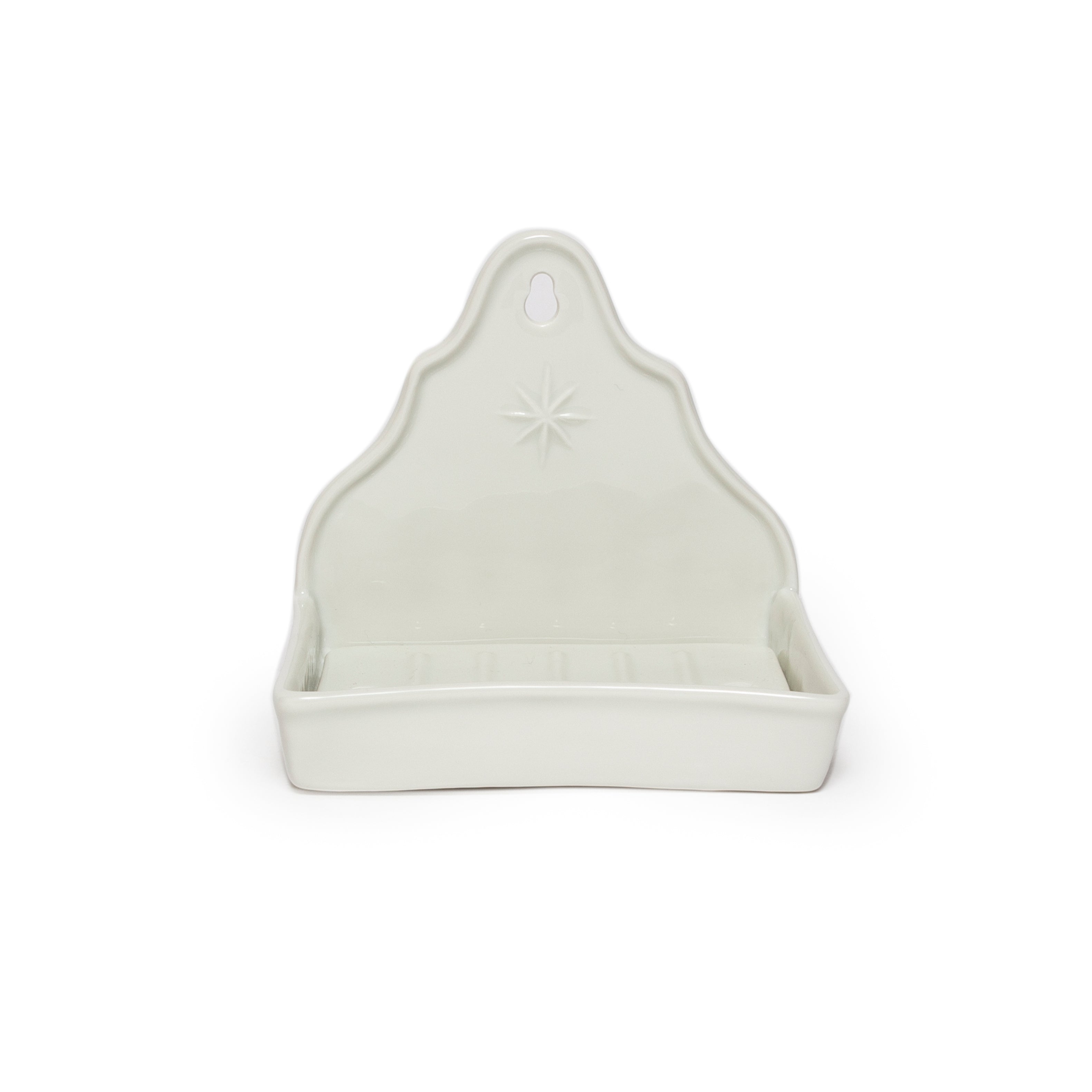 White dish with a star design on a white background