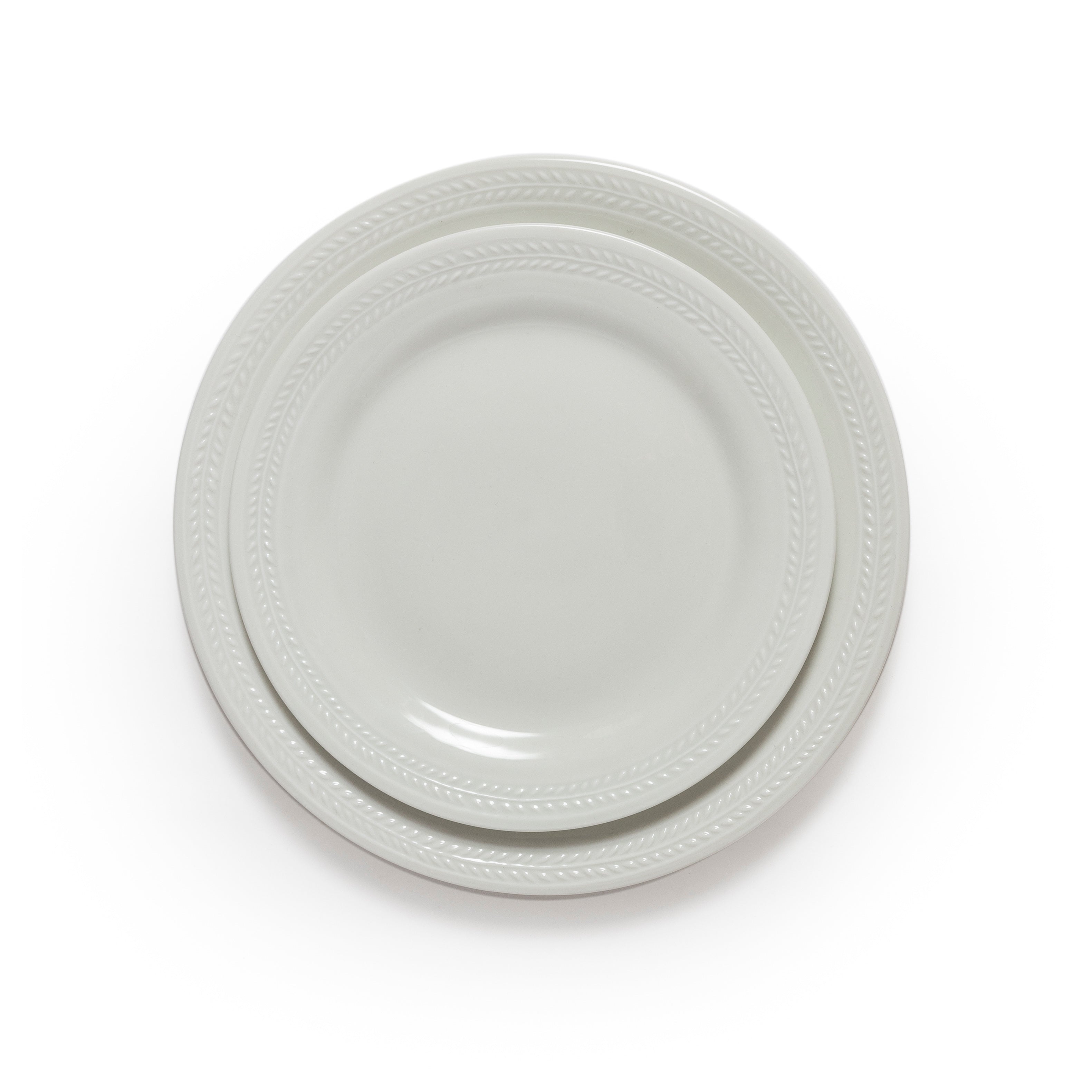 Two white ceramic plates stacked on a white background