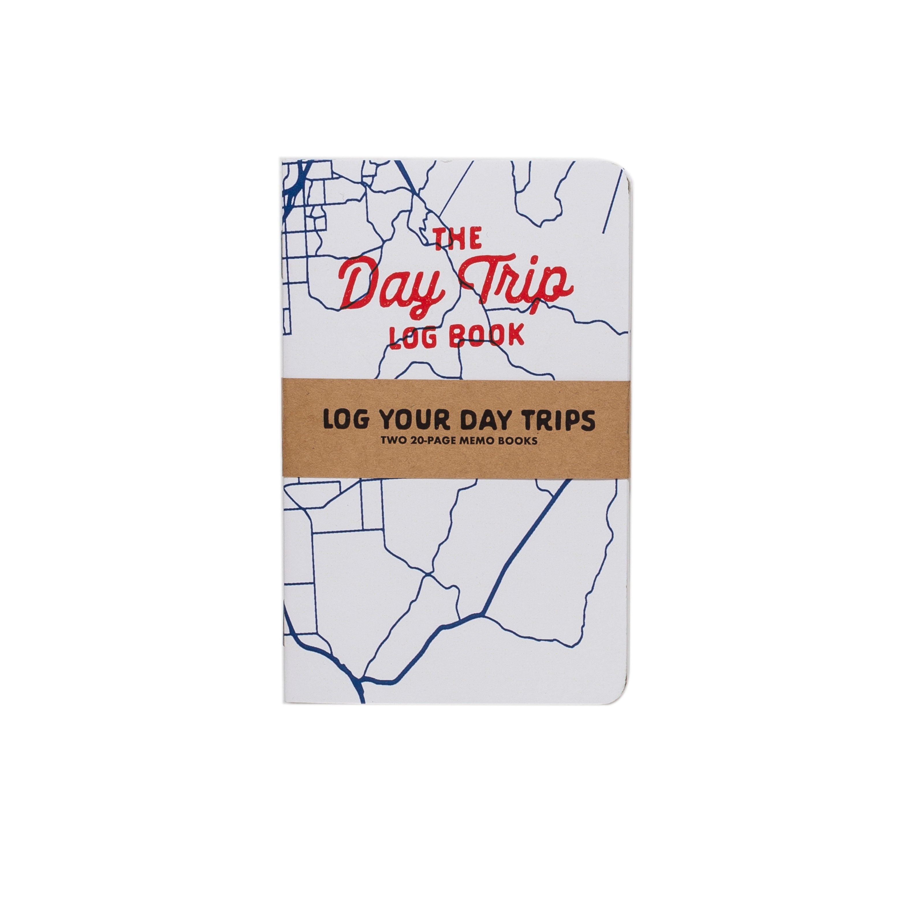 Notebook titled 'The Day Trip Log Book' with map design on a white background