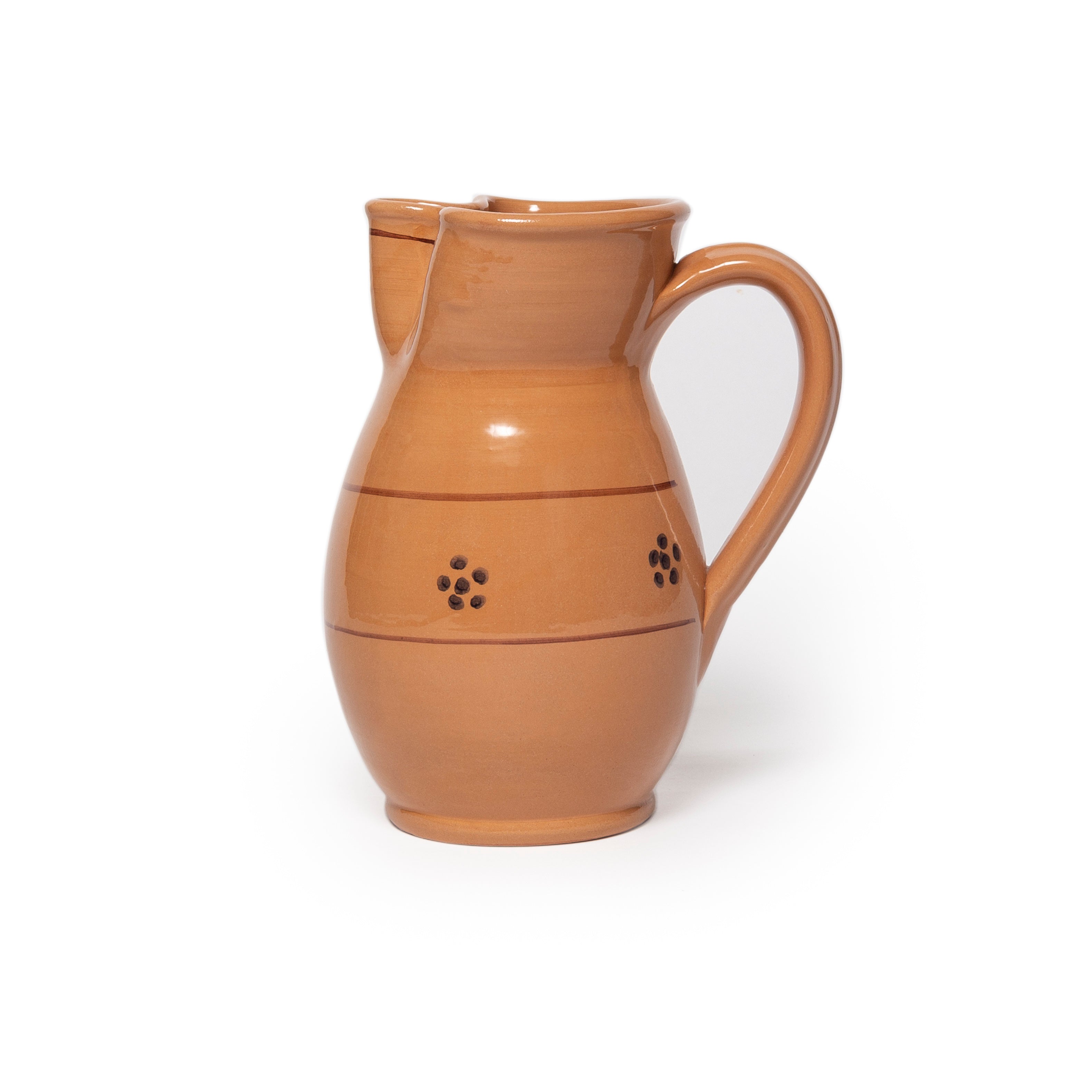 Brown ceramic pitcher on a white background