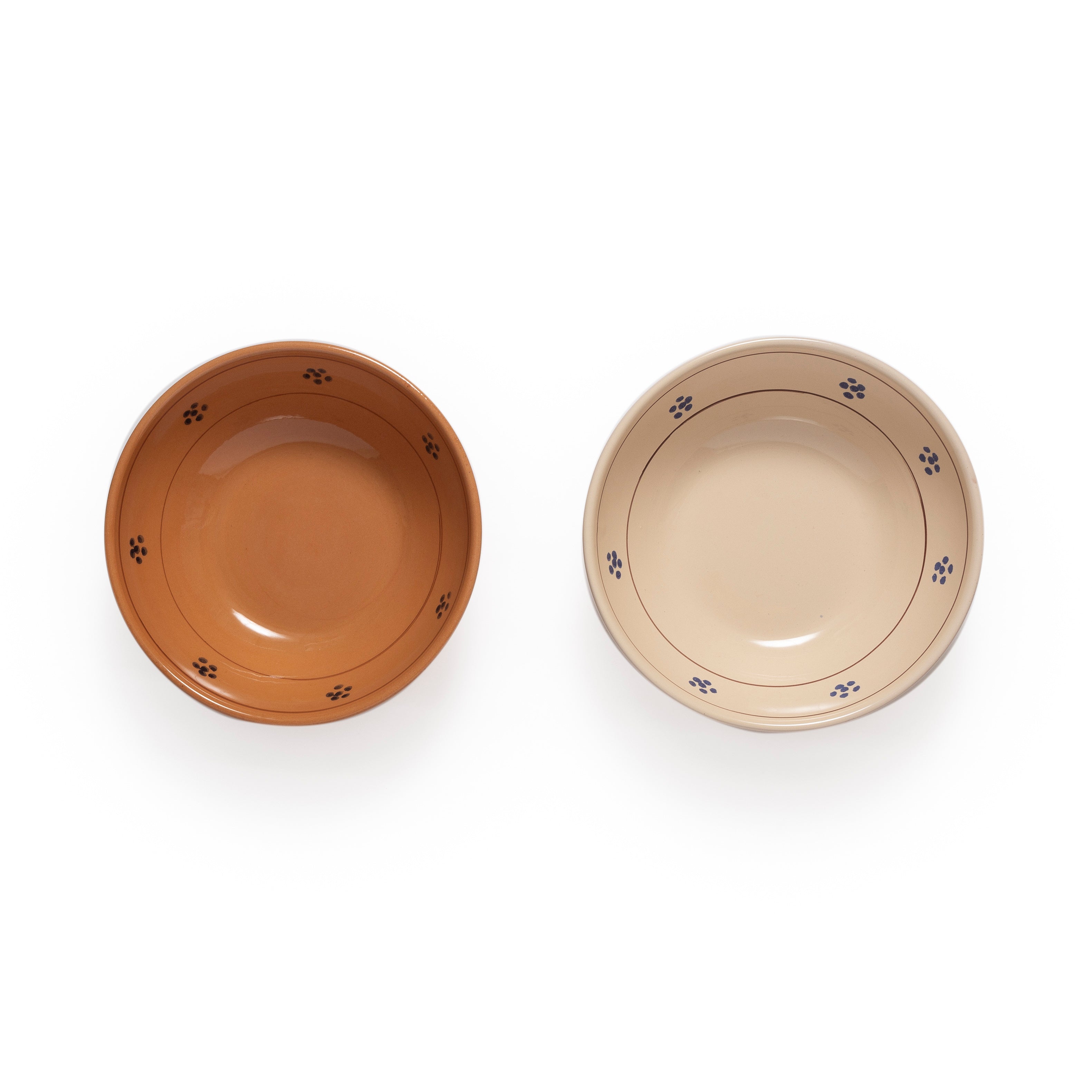 Two ceramic bowls, one brown and one beige, with flower designs on a white background.