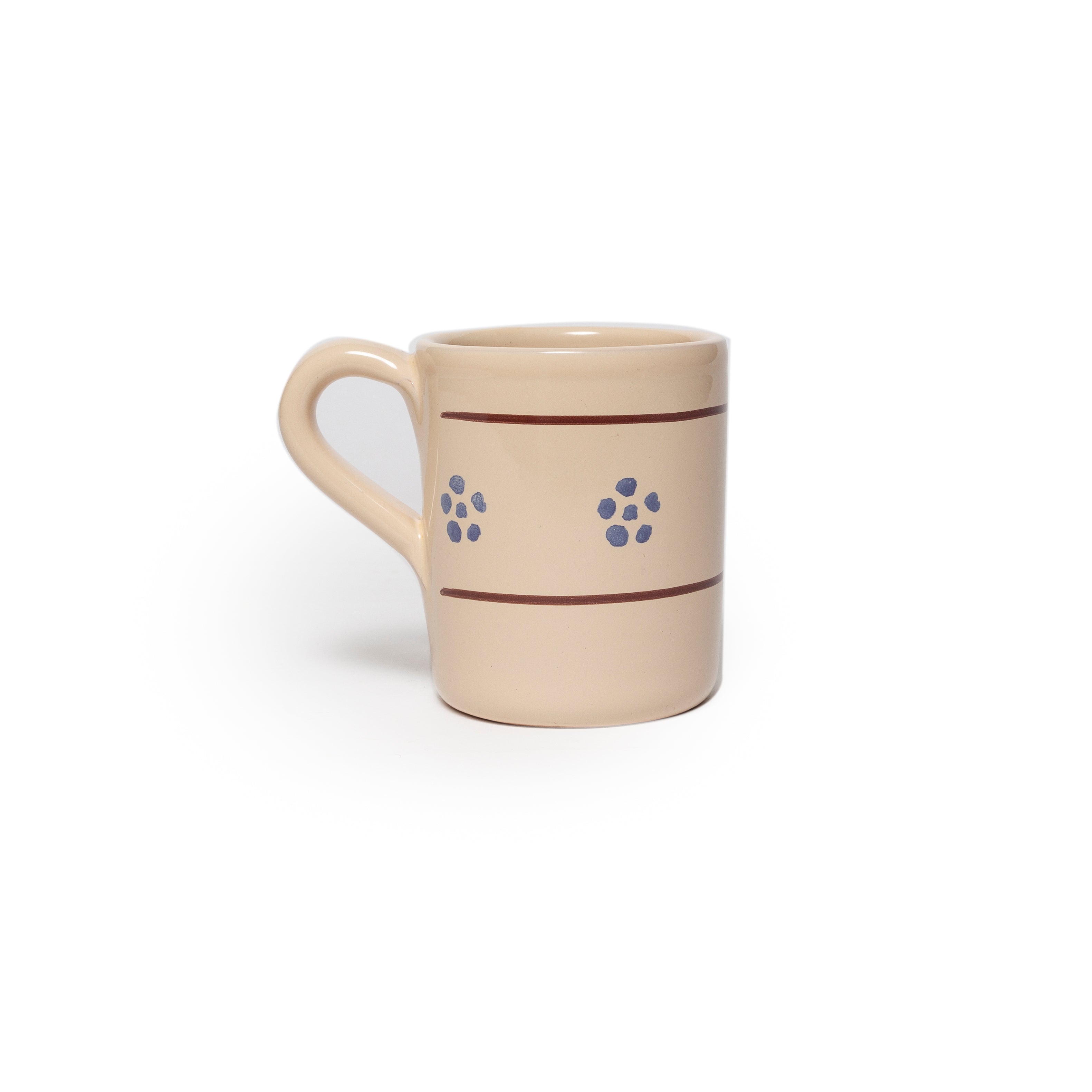 Beige mug with brown stripe and blue flowers on a white background