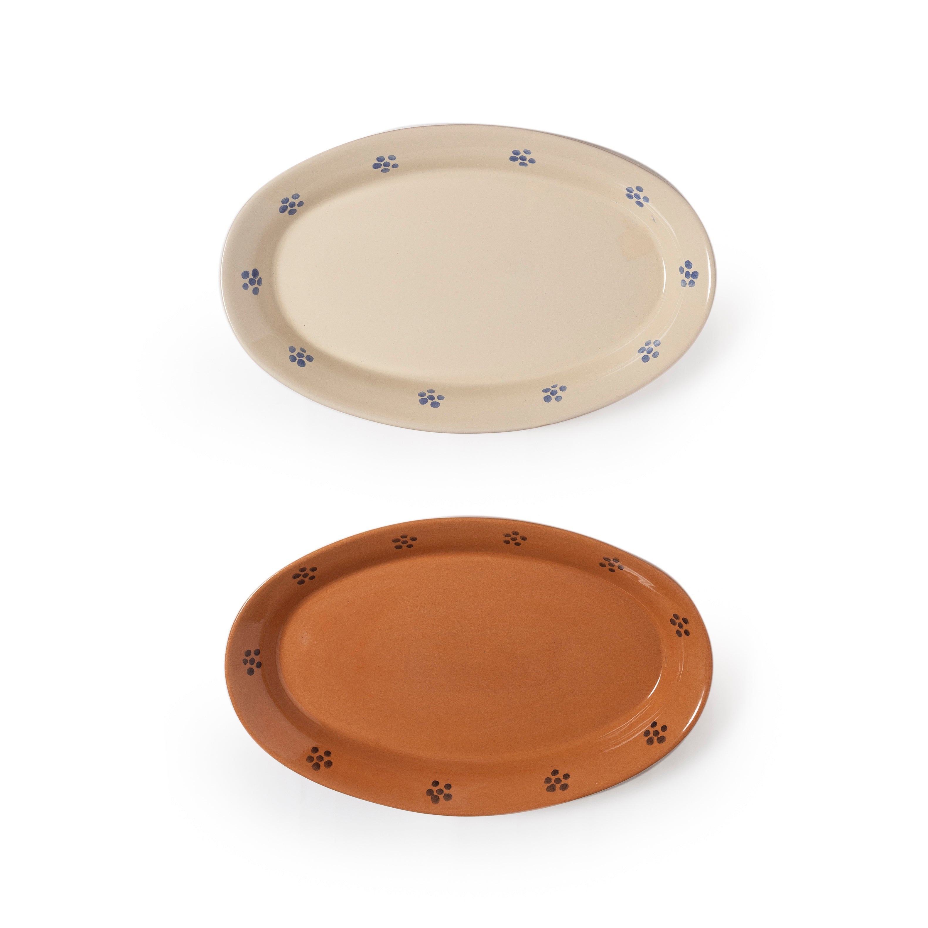 Two ceramic plates, one beige and one brown, with flower designs on a white background.