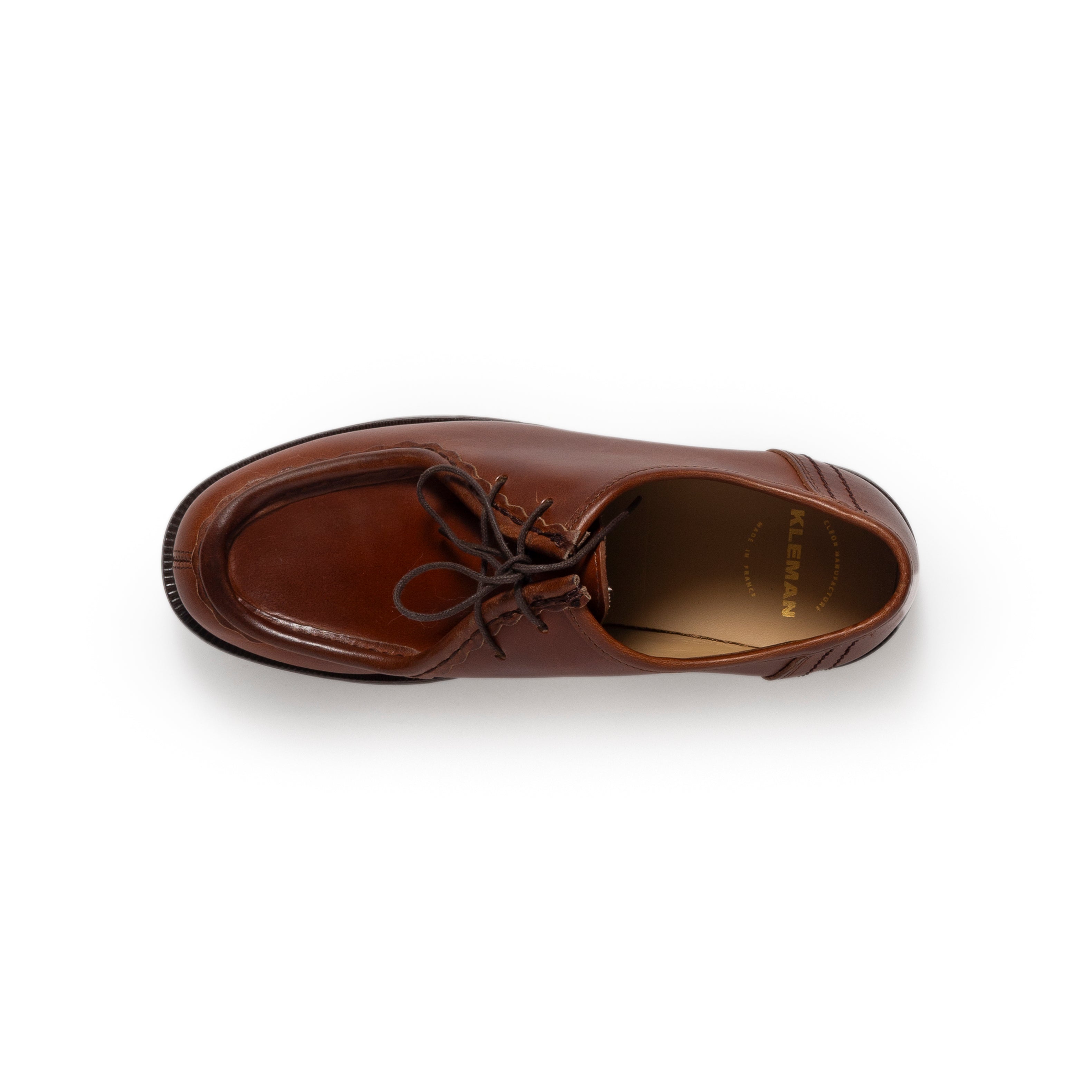 Brown leather shoe on a white background