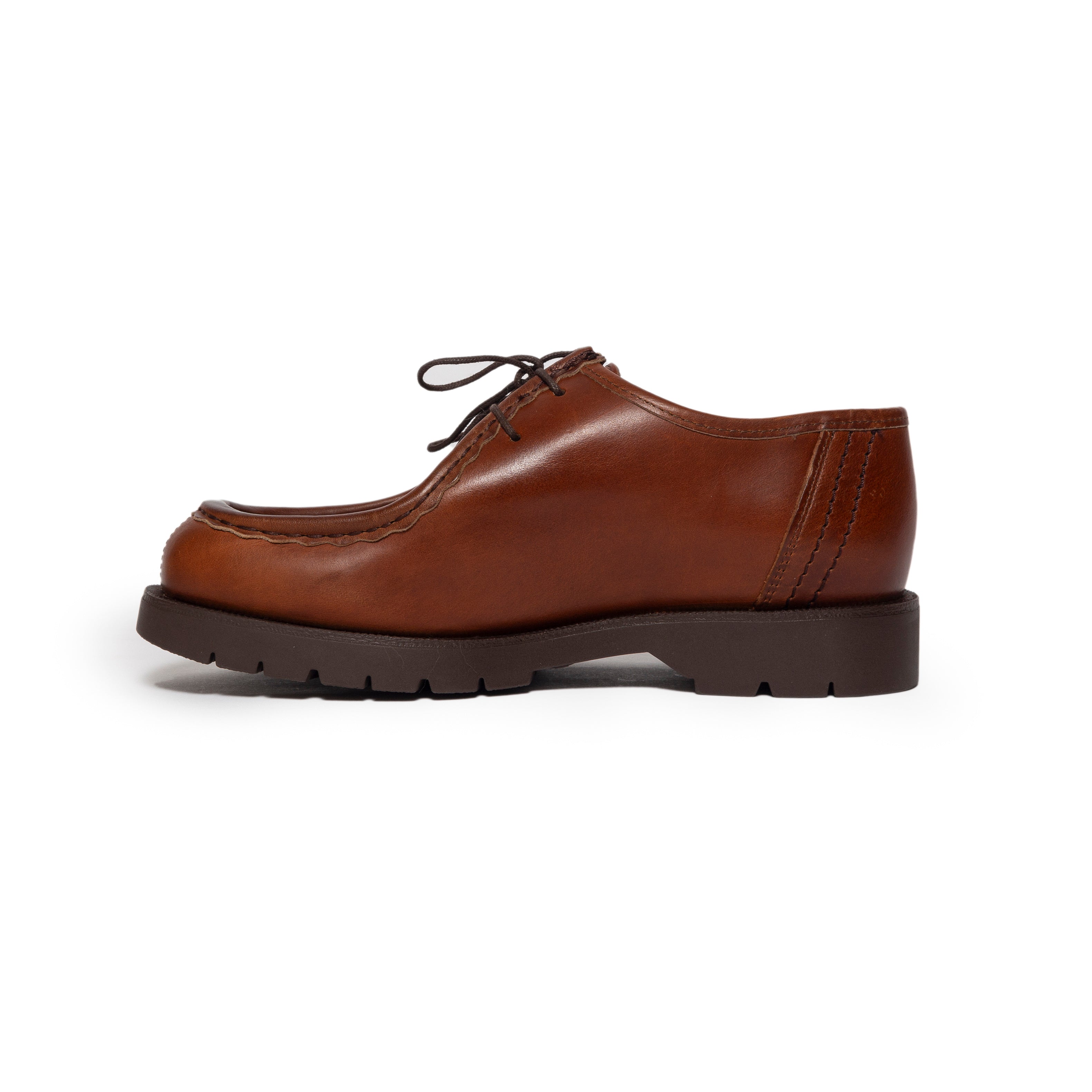 Brown leather shoe on a white background