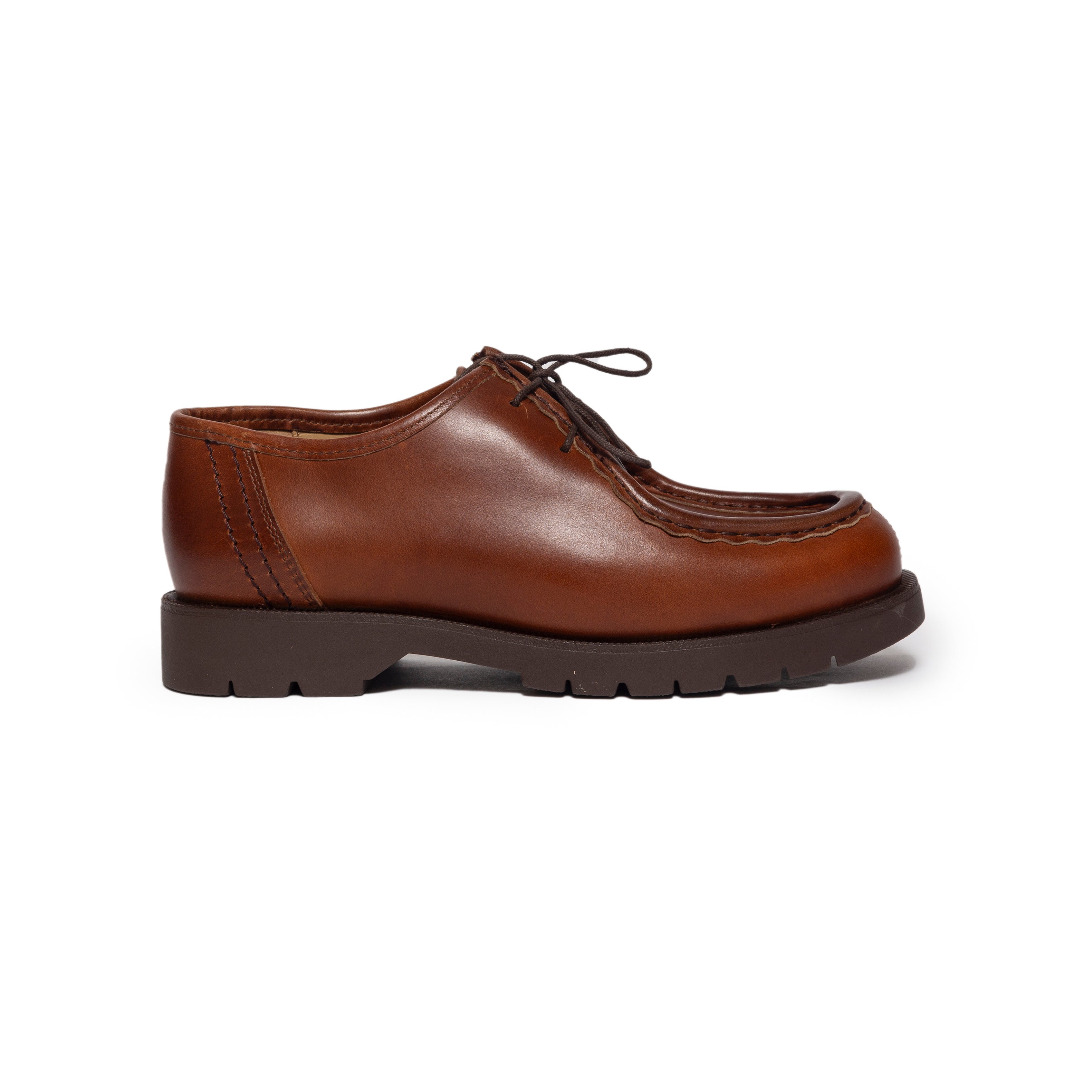 Brown leather shoe on a white background