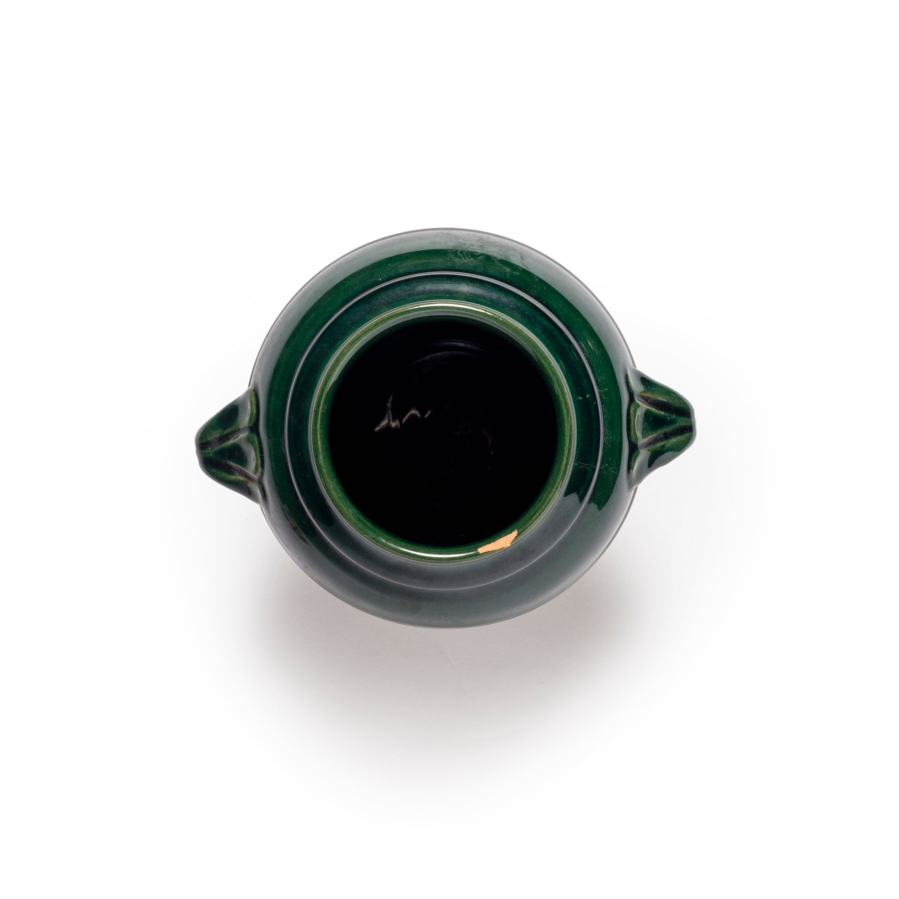 Green ceramic vase on a white background