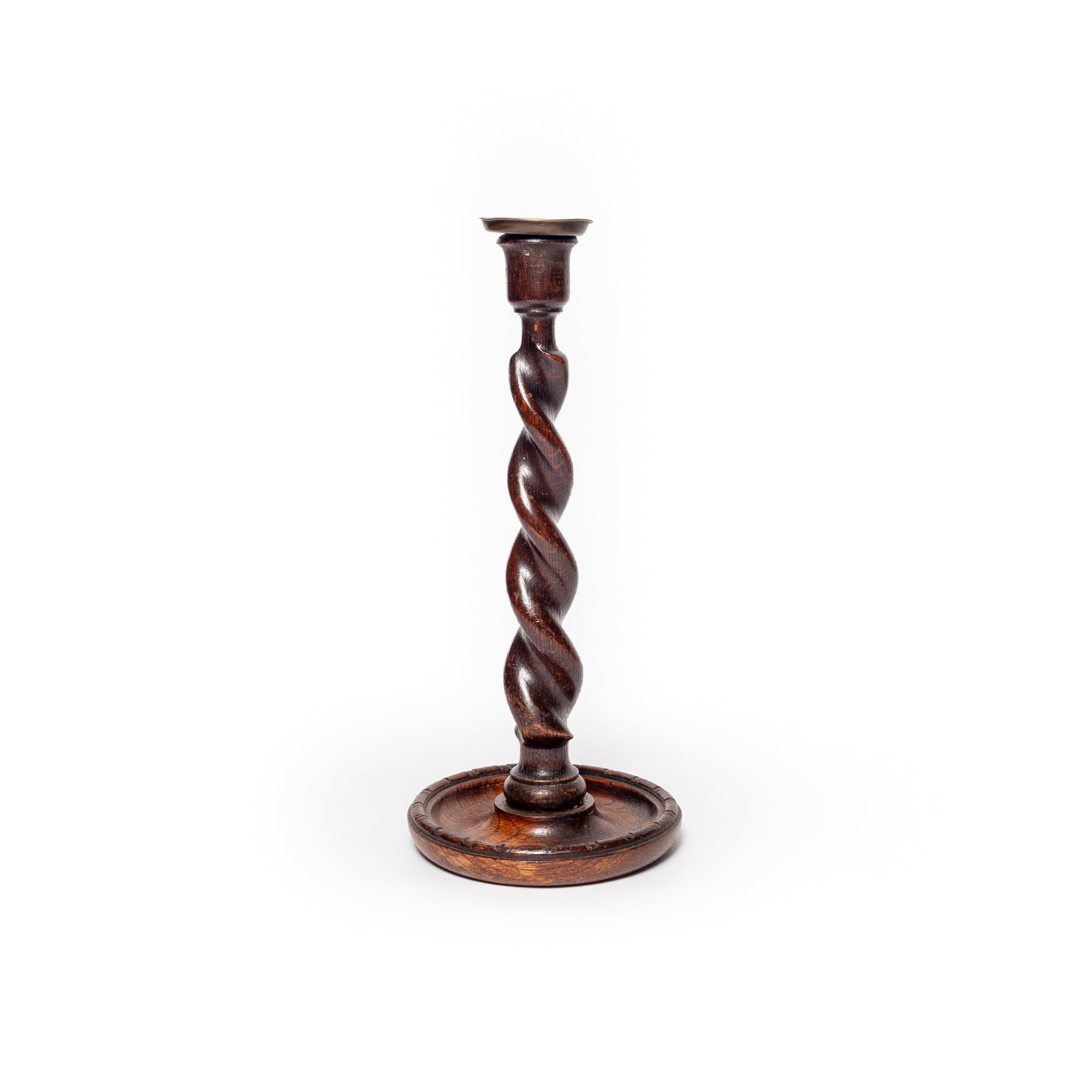Wooden candlestick with twisted design on a white background