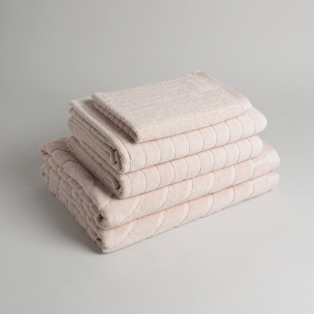 Stack of folded Baina Clovelly Clay towels